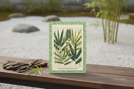 Japanese bamboo journal with Shirasawa Makino 1912 Nihon Chikurui Zufu on wooden bench in zen garden with raked gravel and bamboo plants - LeBonJournal