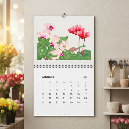 2026 Botanical Wall Calendar displayed as hero in a cozy flower shop — January Cyclamen plate from Seiyô Sôka Zufu, 1917 Japanese botanical illustration — LeBonJournal
