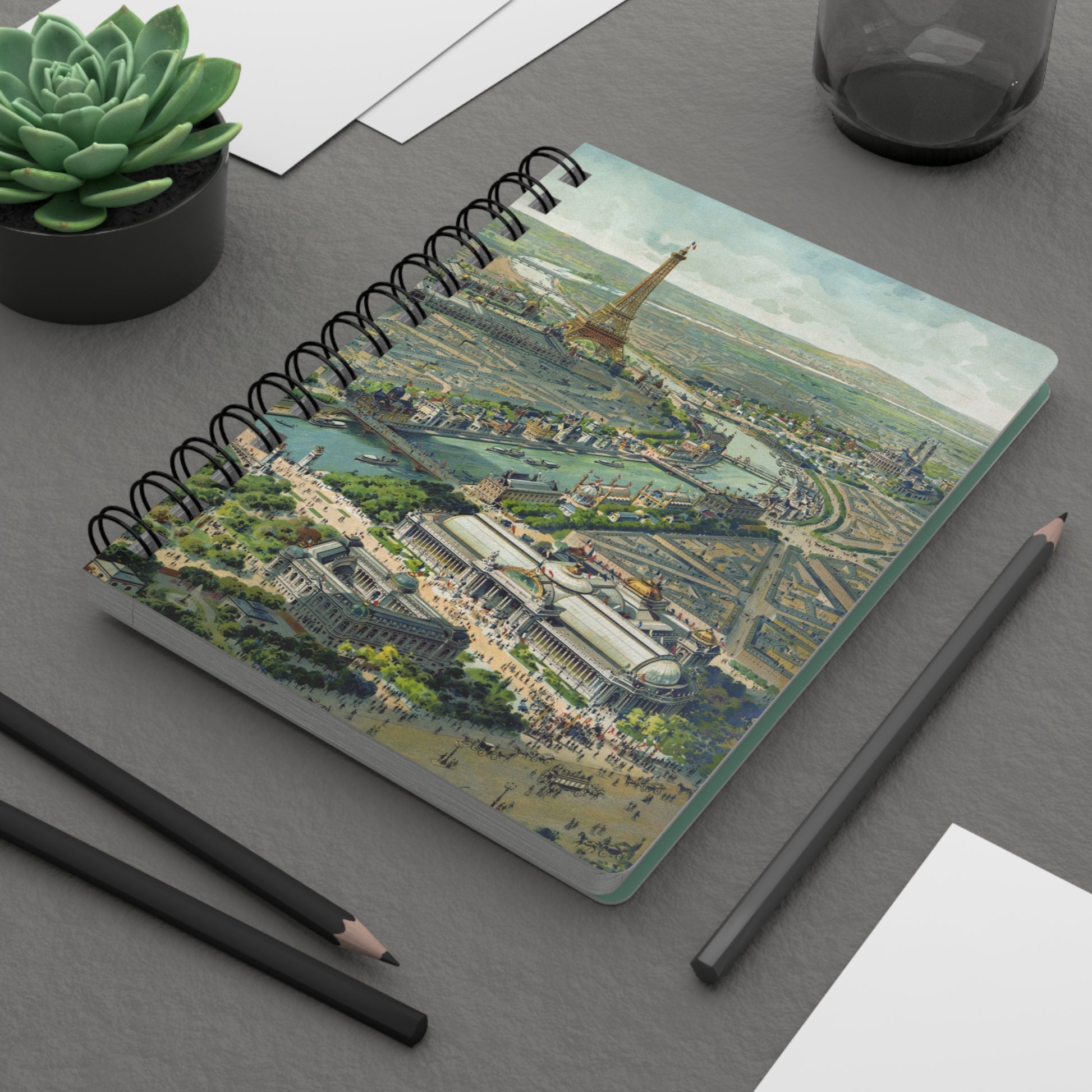 Baylac 1900 Exposition Universelle spiral journal on workspace with pencils celebrating Lucien Baylac's 1900 Paris panoramic illustration - LeBonJournal