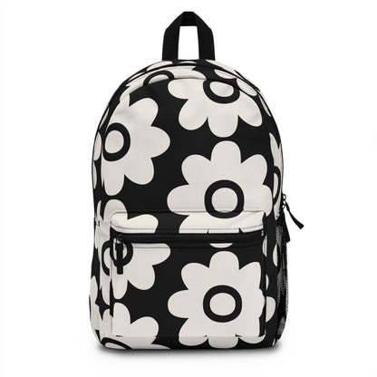 Bold retro daisy backpack black and white floral front view with oversized groovy daisy motifs - LeBonJournal