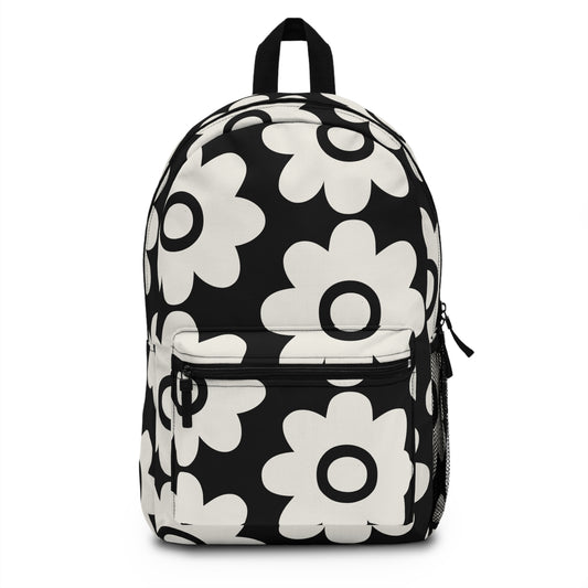 Bold retro daisy backpack black and white floral front view with oversized groovy daisy motifs - LeBonJournal