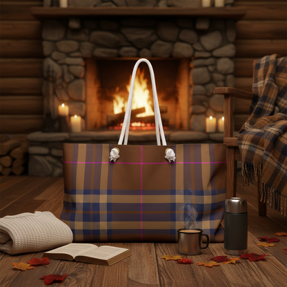 Brown plaid weekender bag styled for an autumn cabin weekend with knit sweater thermos and warm firelight - LeBonJournal