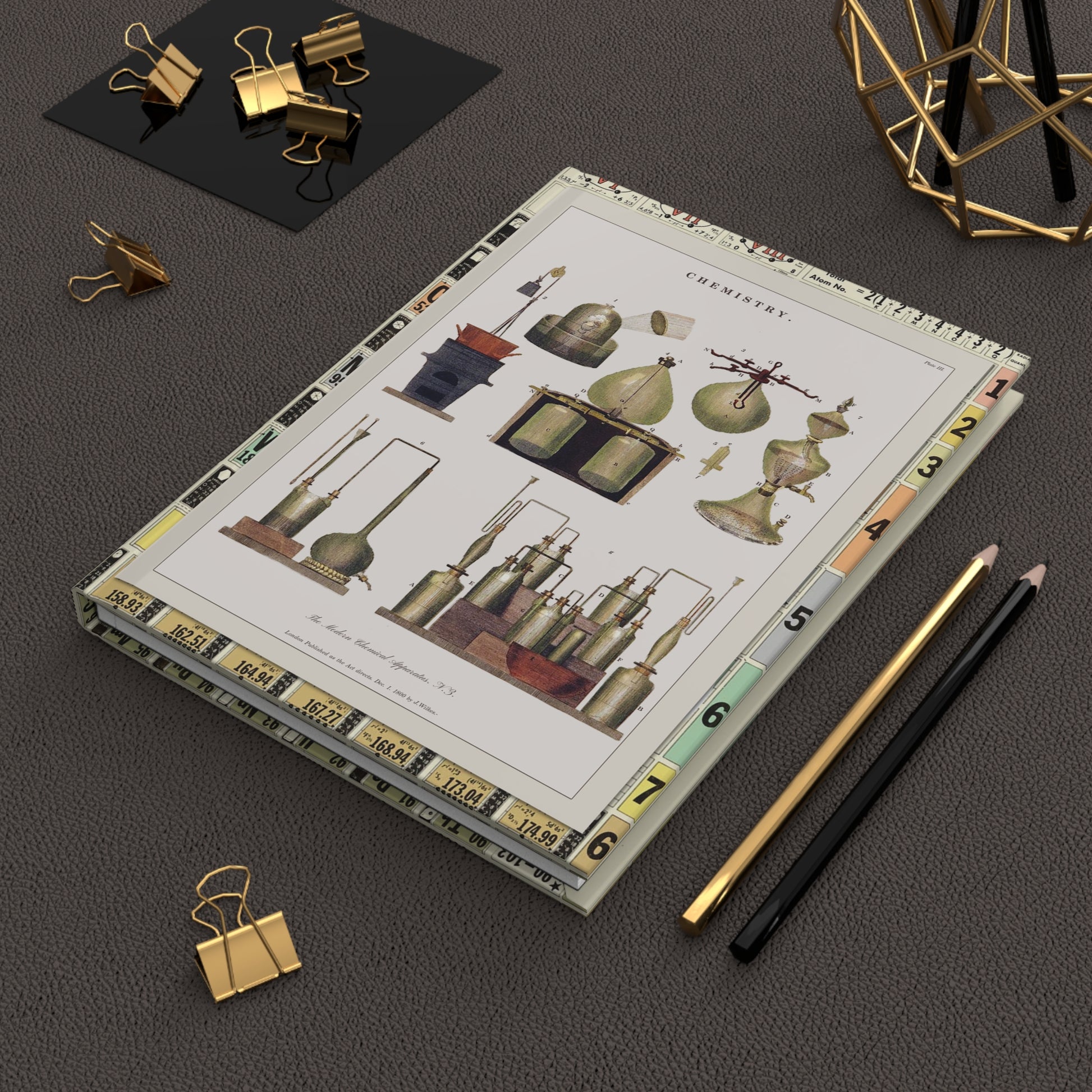 Chemical Charts hardcover journal in lifestyle setting, premium matte finish journal featuring vintage chemistry apparatus engravings, elegant stationery for chemists, students, and science historians - LeBonJournal