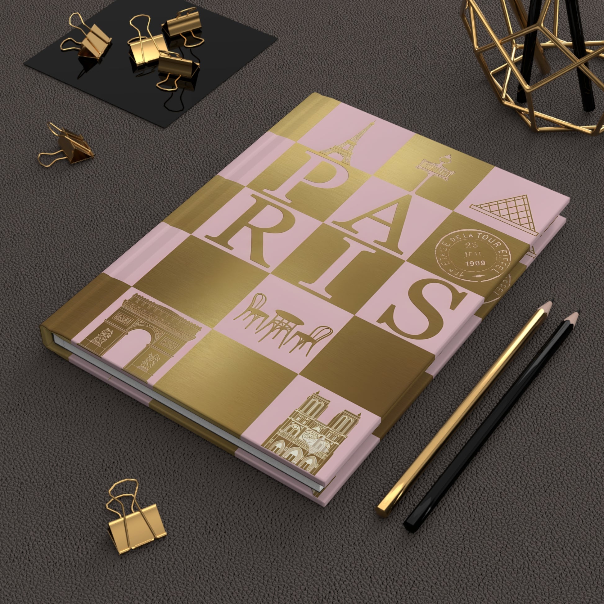 Chic Paris journal Dior pink gold checkerboard iconic Parisian landmarks design on workspace - LeBonJournal