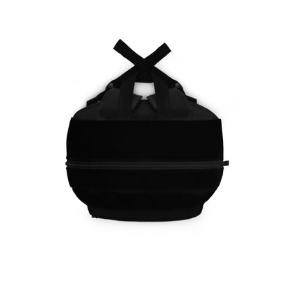 Classic black backpack top view showing handle and zipper closures - LeBonJournal