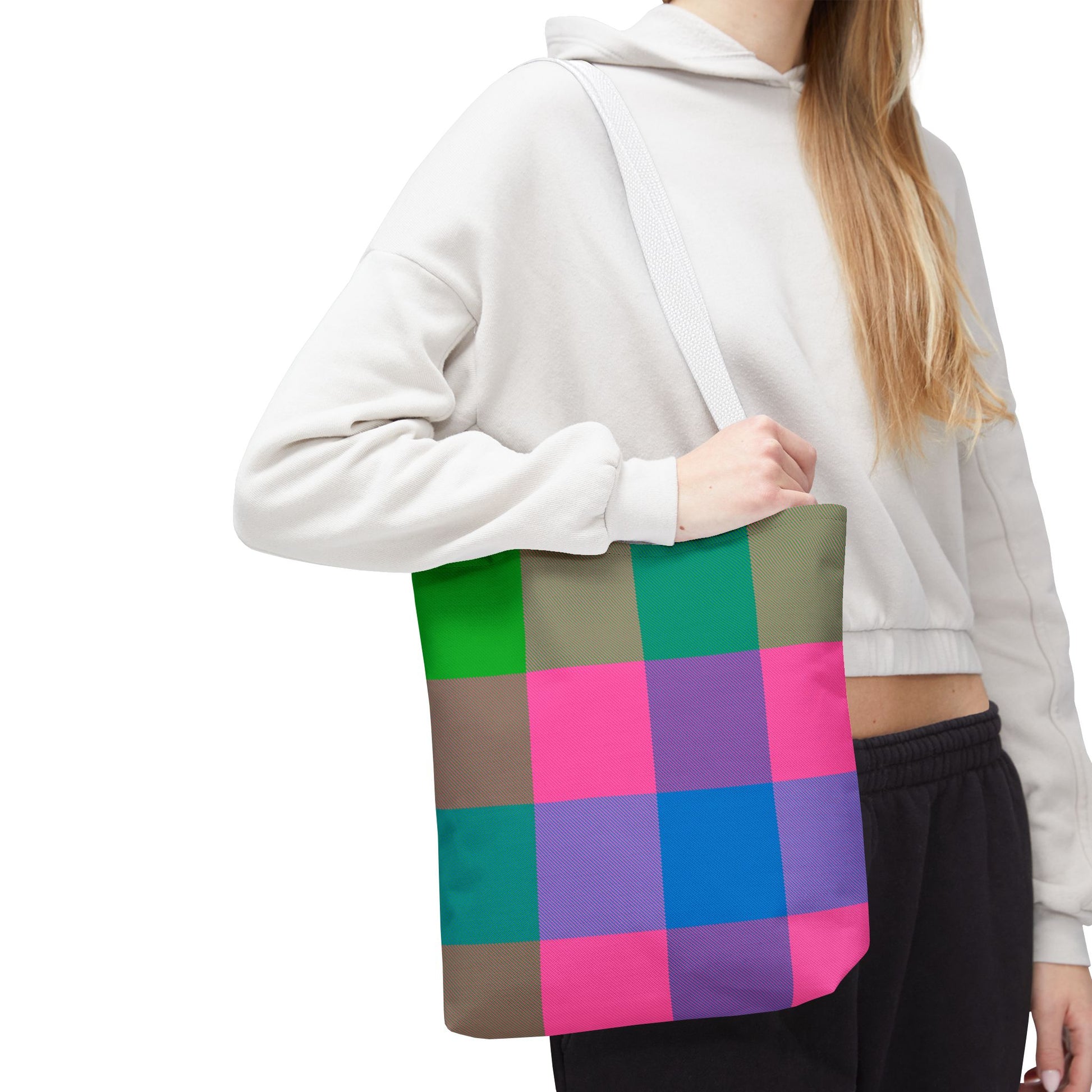 Young woman wearing colorblock check tote bag 13×13 on shoulder with bold stripe design - LeBonJournal