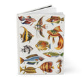 Hardcover marine life journal standing upright showing front cover with vintage Tesoro de la Juventud aquarium fish illustrations including Betta, Angelfish, Moorish Idol, Goldfish, and Seahorse on matte finish cover - LeBonJournal