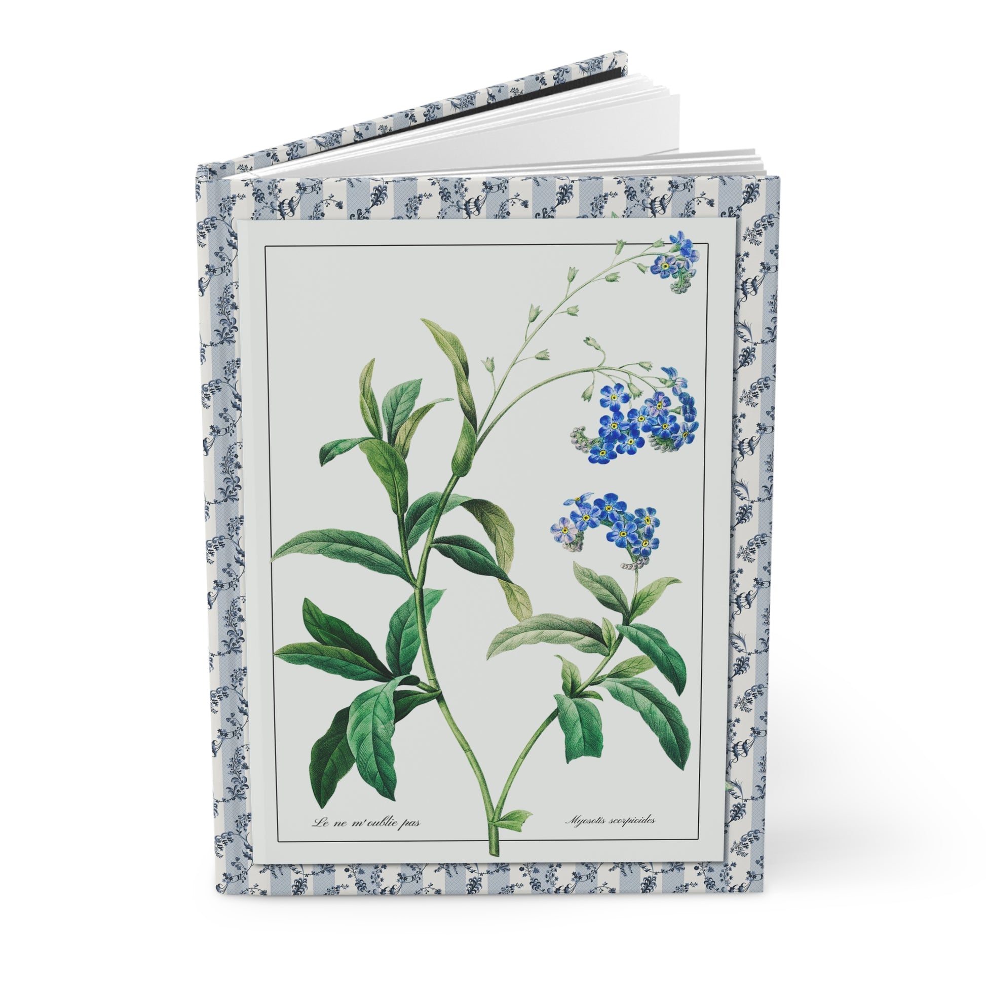 Hardcover forget-me-not journal standing upright showing front cover with Pierre-Joseph Redouté Myosotis scorpioides illustration from La Botanique de J. J. Rousseau featuring delicate blue flowers on matte finish cover - LeBonJournal