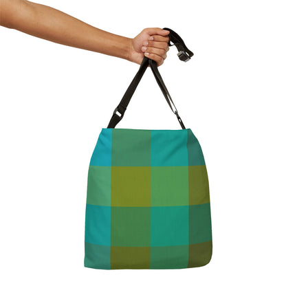 Hand holding green plaid crossbody bag by adjustable strap, turquoise and green tartan design - LeBonJournal