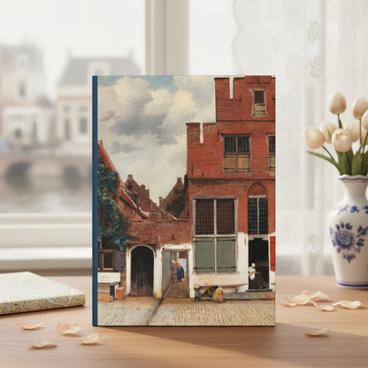 Johannes Vermeer Delft Views journal at Dutch canal house window with Delft blue vase tulips and antique map - LeBonJournal
