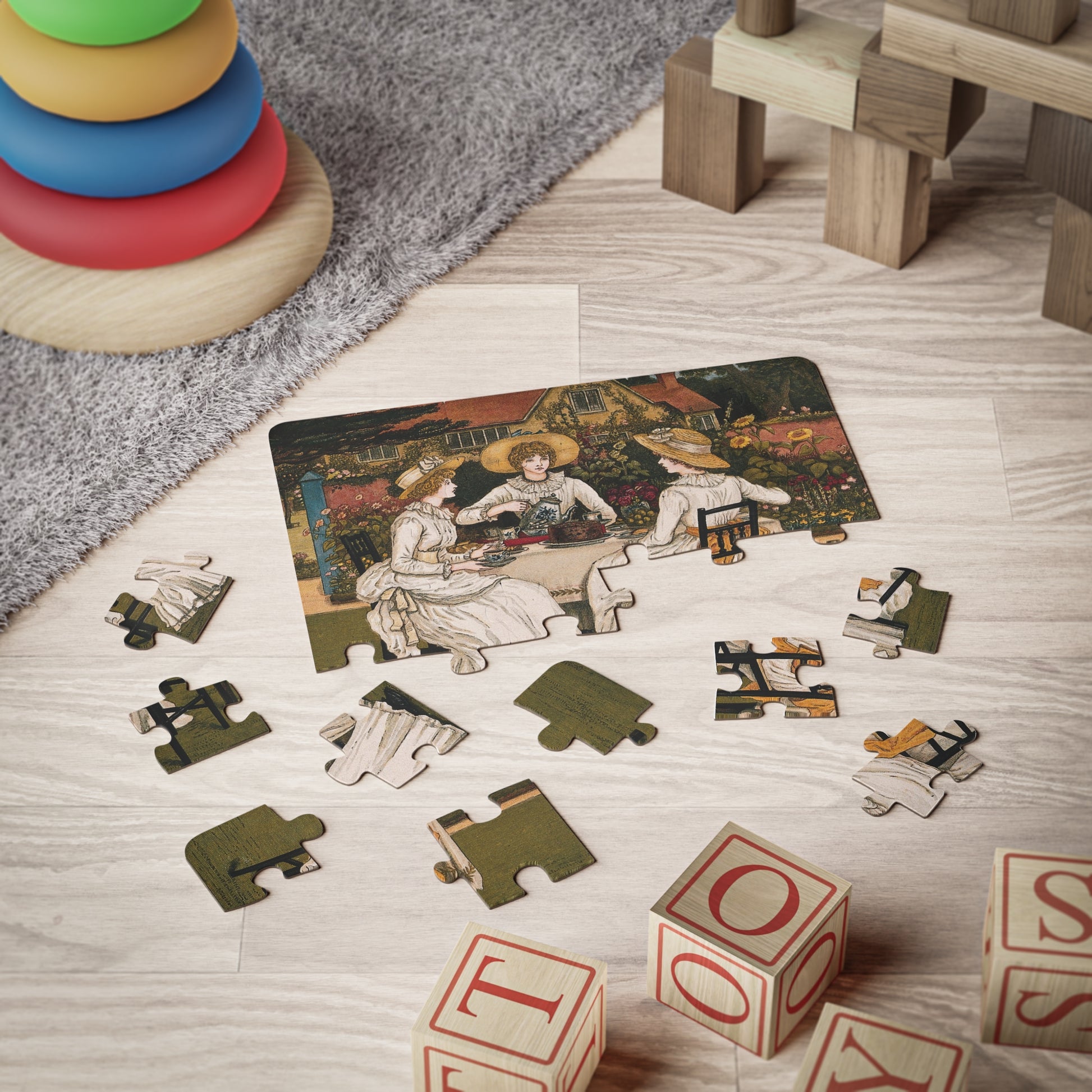  Kate Greenaway 1887 tea party puzzle mid-assembly surrounded by children's toys in playroom setting - LeBonJournal