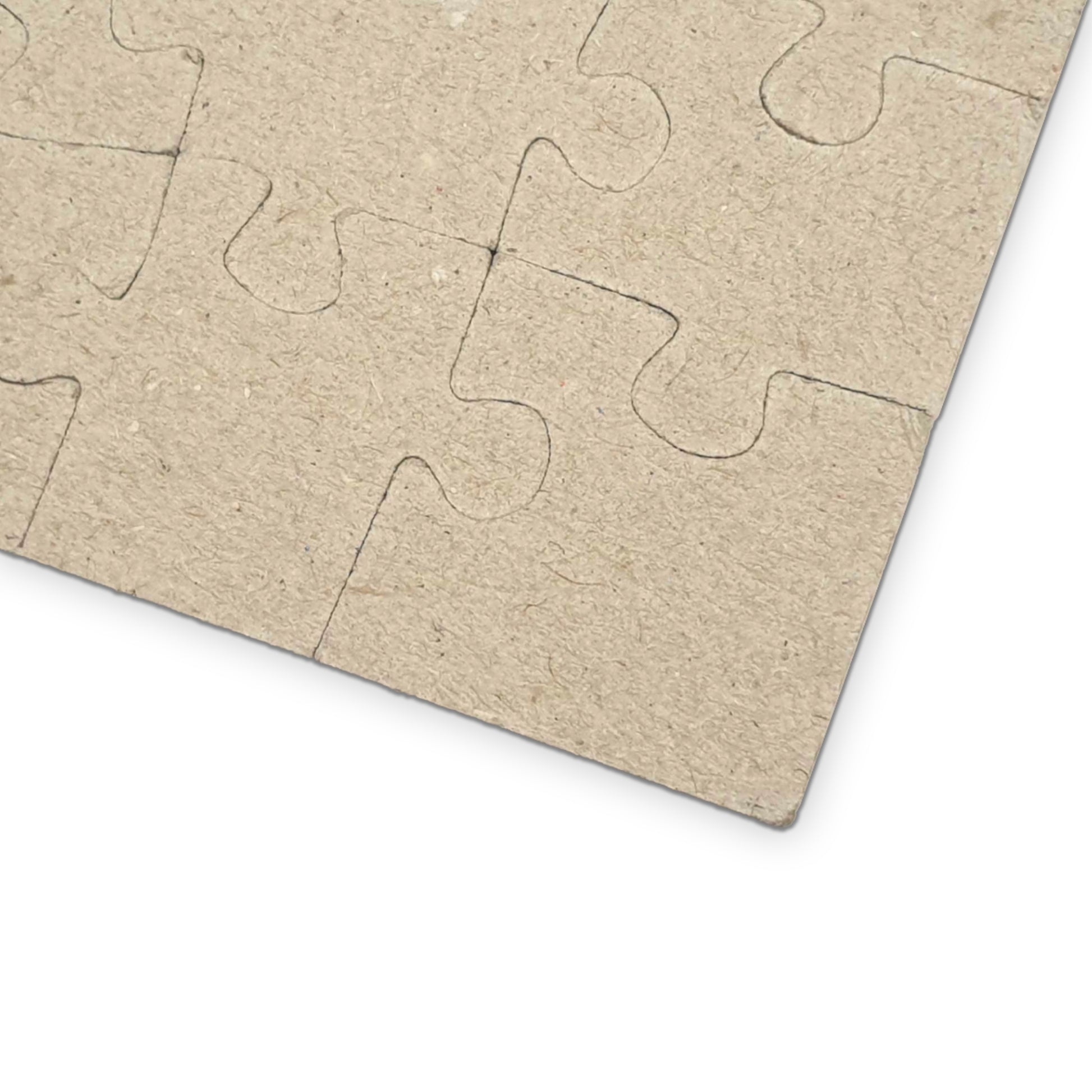 Monet Water Lily Bridge puzzle collection reverse side showing precision-cut chipboard pieces and interlocking design - LeBonJournal