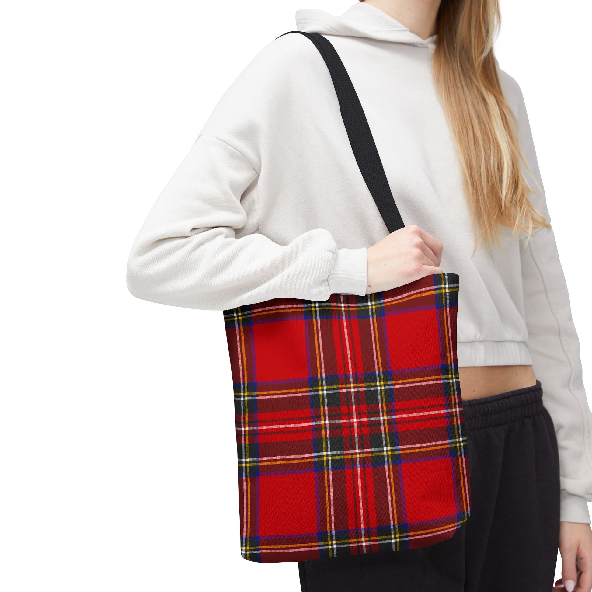 Young woman wearing red tartan tote bag 13×13 on shoulder with Royal Stewart plaid pattern - LeBonJournal