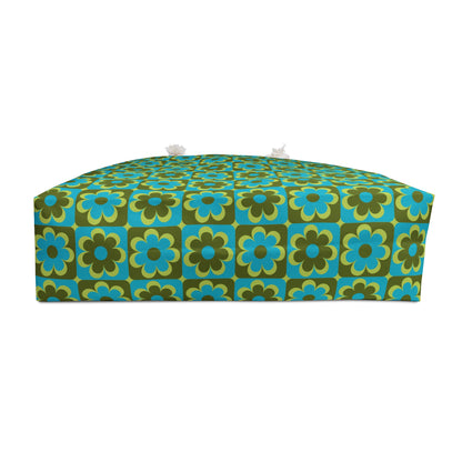 Retro floral weekender bag showing structured T-bottom base in teal olive and cream 70s pop floral pattern - LeBonJournal