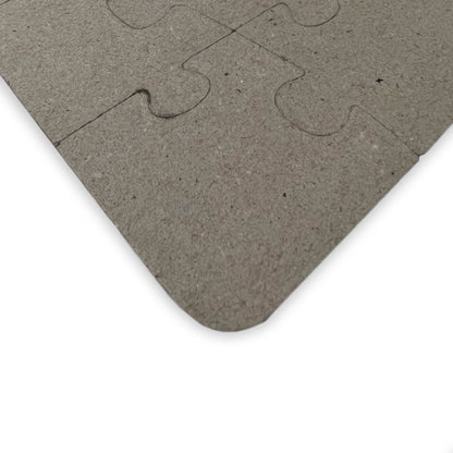 Stegosaurus kids' puzzle back showing durable laminated chipboard and interlocking piece cuts - LeBonJournal