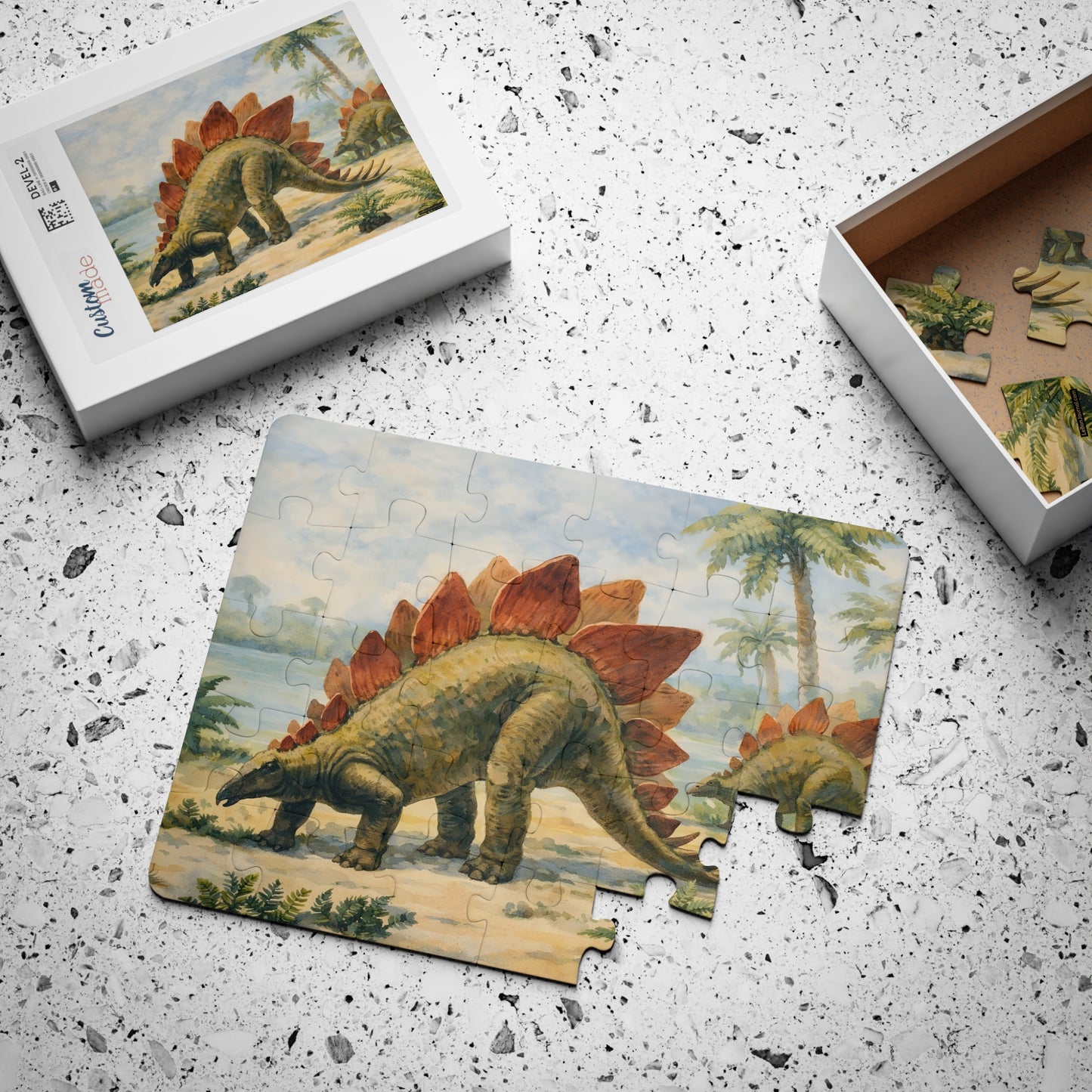 Stegosaurus kids' puzzle mid-assembly with box showing full-color reference image, 30 large pieces - LeBonJournal