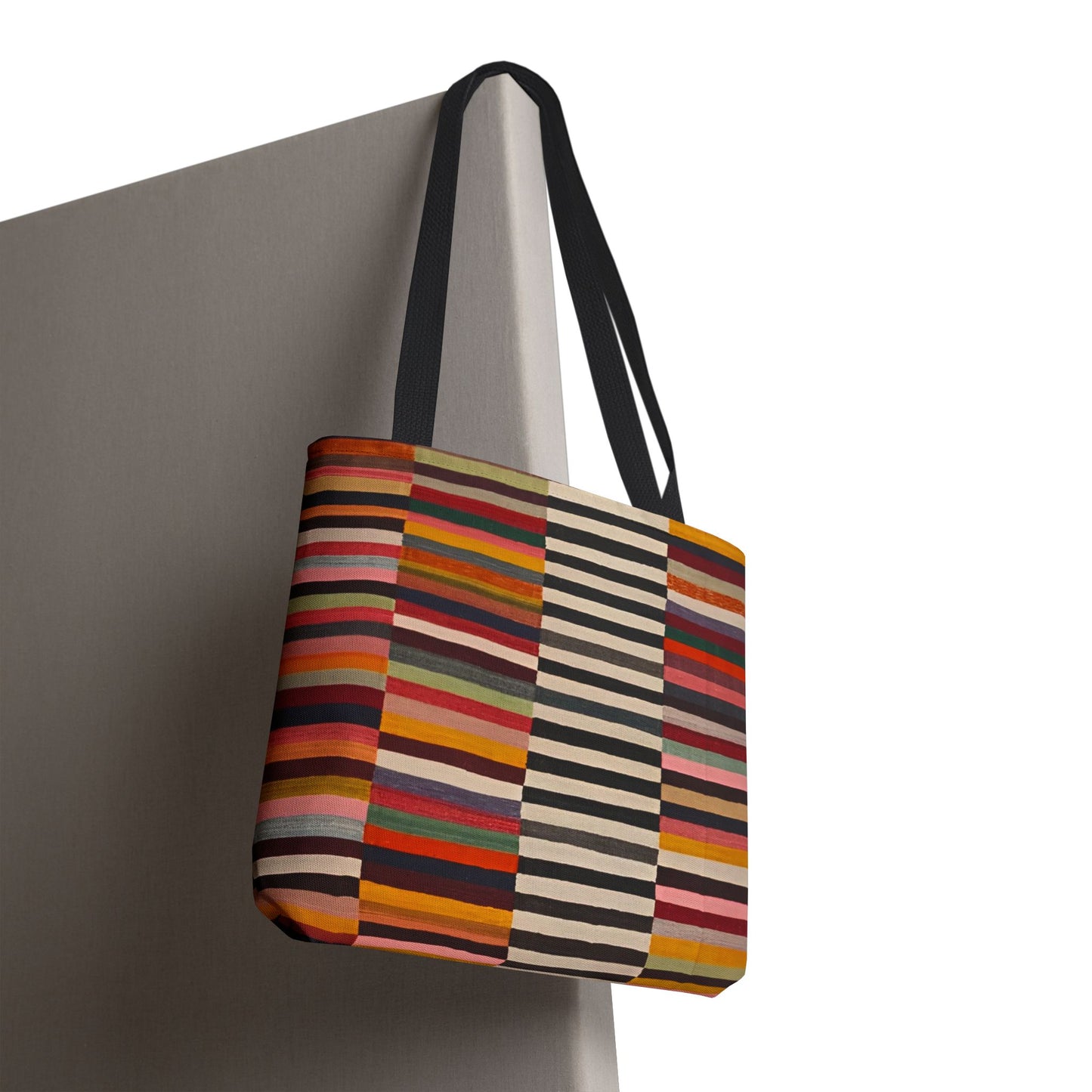 Striped colorblock tote bag hanging, showing full front design and black reinforced handles - LeBonJournal