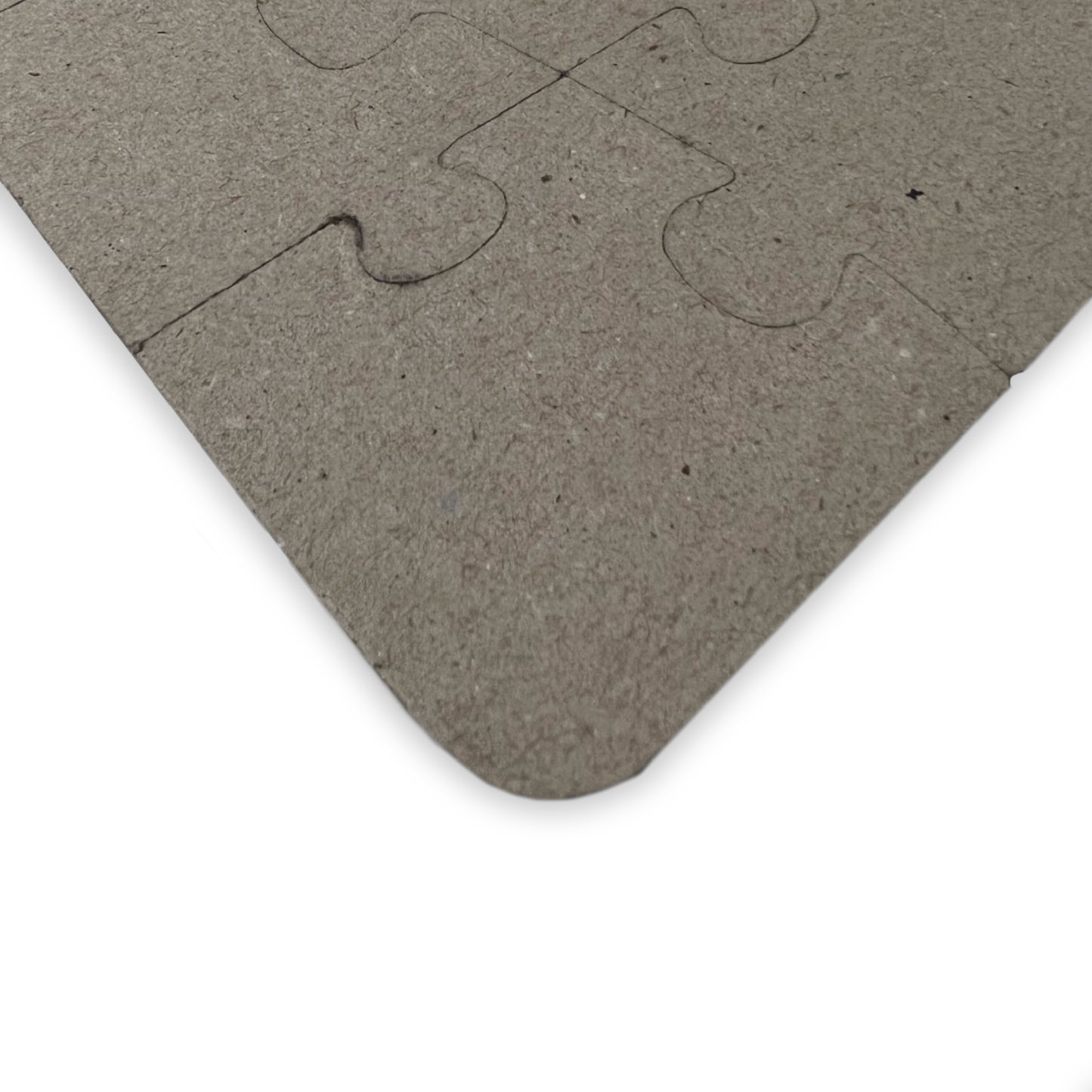 Struthiomimus kids' puzzle back showing durable laminated chipboard and interlocking piece cuts - LeBonJournal