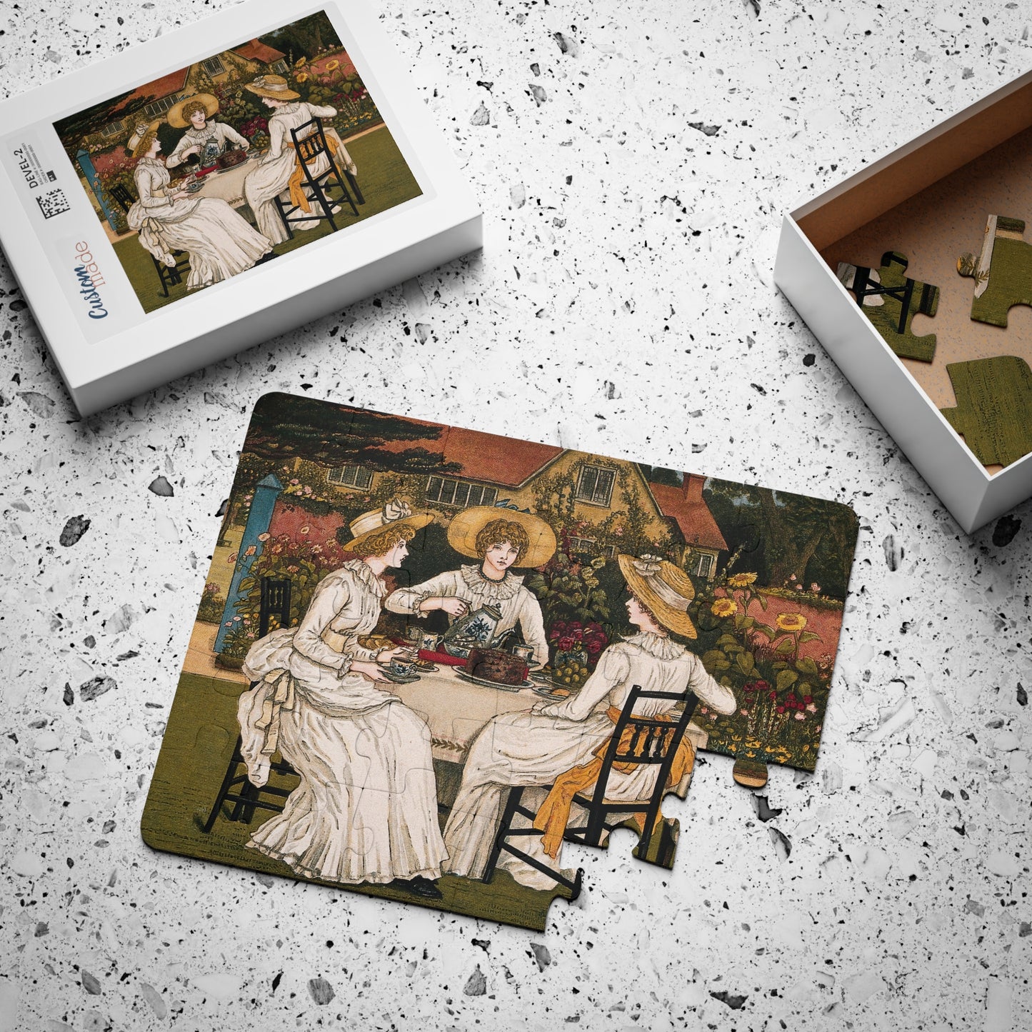 Tea party kids' puzzle mid-assembly with box showing full-color reference image, 30 large pieces - LeBonJournal