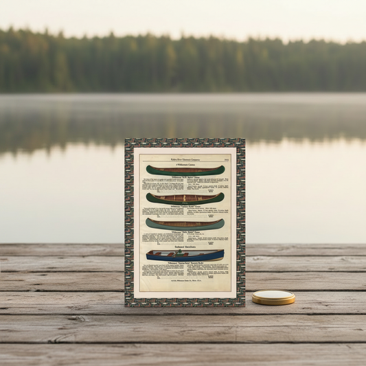 Vintage canoe catalog blank journal at wilderness lake dock with brass compass and canoe on still water - LeBonJournal