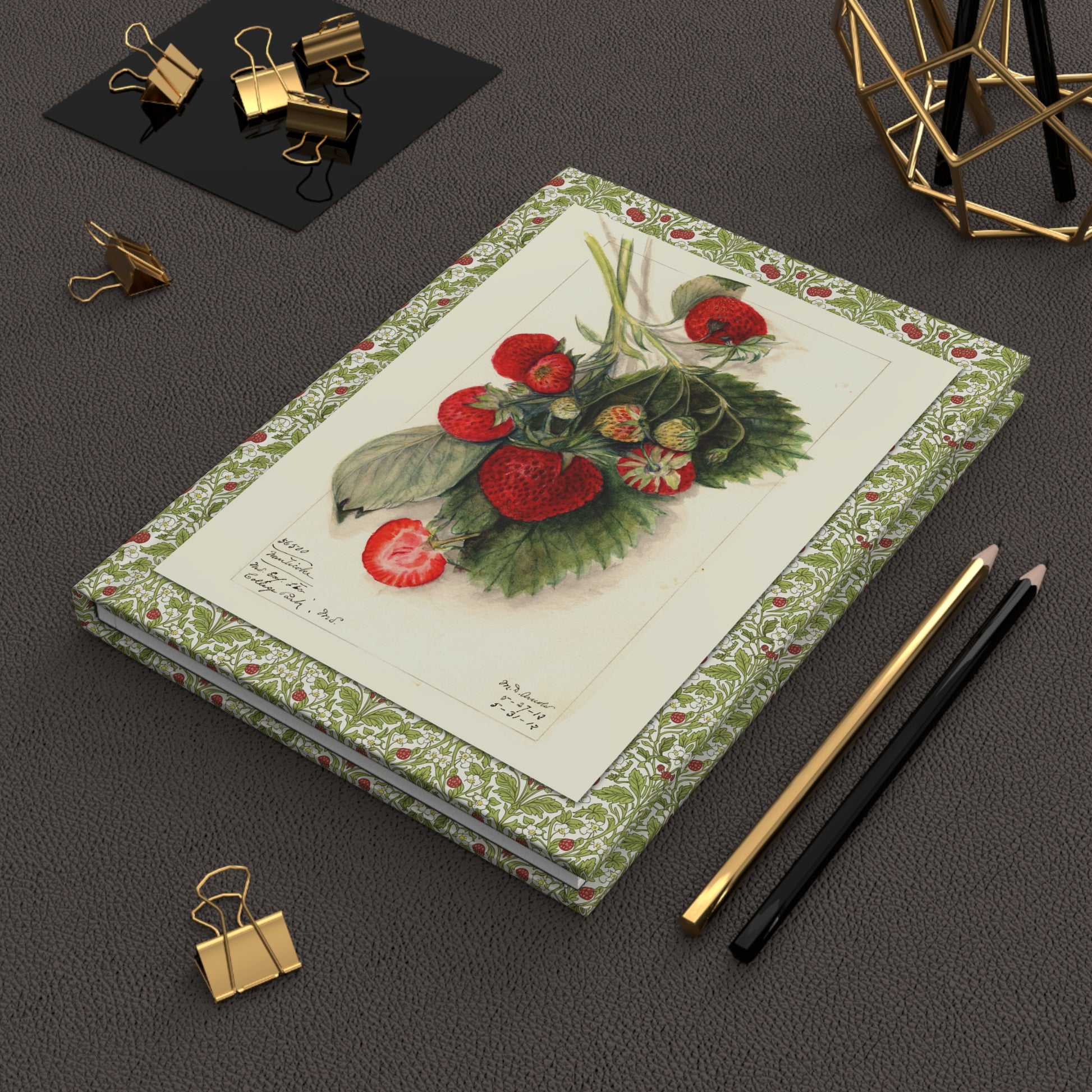 USDA strawberry botanical journal on desk with gold clips for garden journaling - LeBonJournal