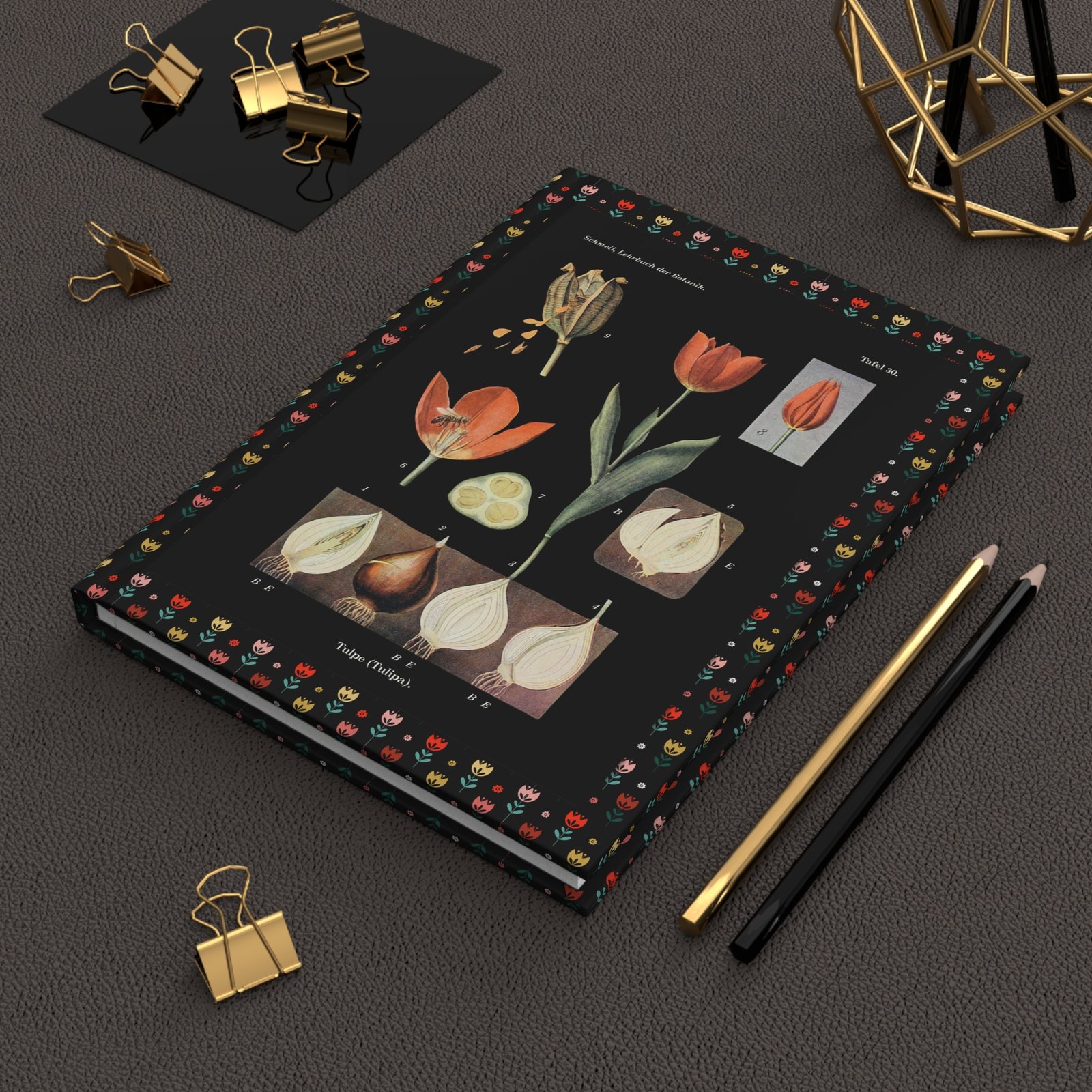 Tulip Botanical Journal on Study Desk with Stationery Hardcover tulip journal arranged on a wooden desk alongside vintage study supplies and botanical tools.