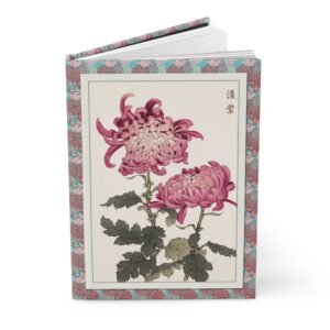 Standing, slightly opened hardcover journal featuring a vintage 1893 Japanese woodblock print of pink chrysanthemums by Keika Hasegawa with a decorative floral border.